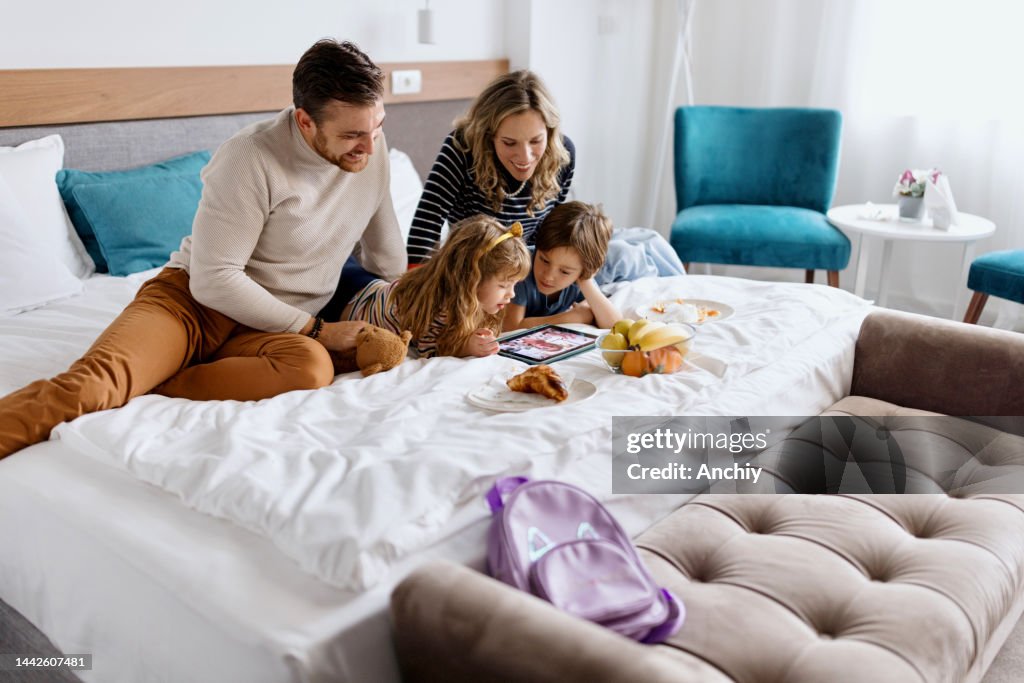 Happy family on a video call with grandmother