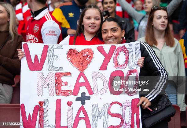 Arsenal fans hold up a message of love to Beth Mead of Arsenal Women and Leah Williamson of Arsenal Women after the FA Women's Super League match...