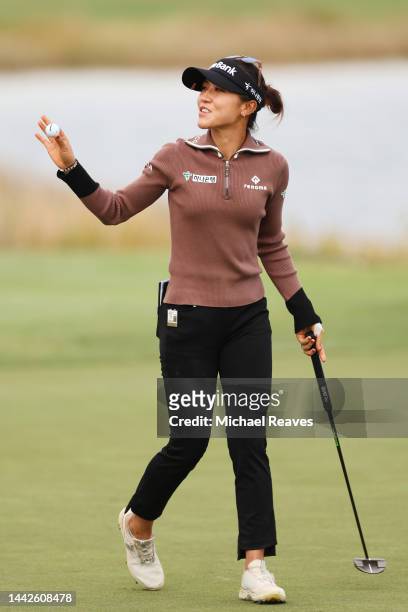 Lydia Ko of New Zealand acknowledges the fans after putting for par on the 18th green during the second round of the CME Group Tour Championship at...