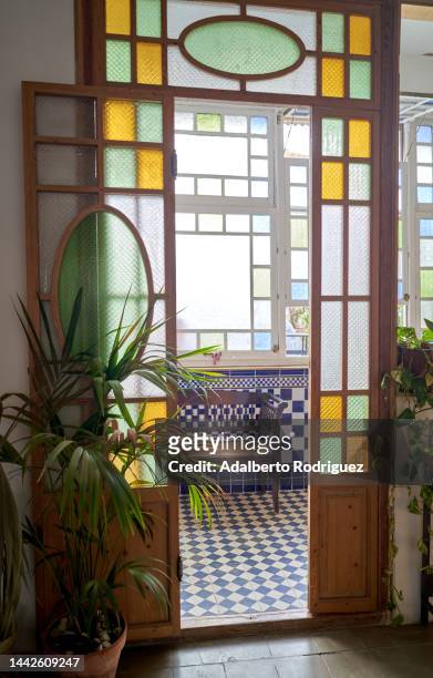 interior of a room with stained glass windows, - stained glass door stock pictures, royalty-free photos & images