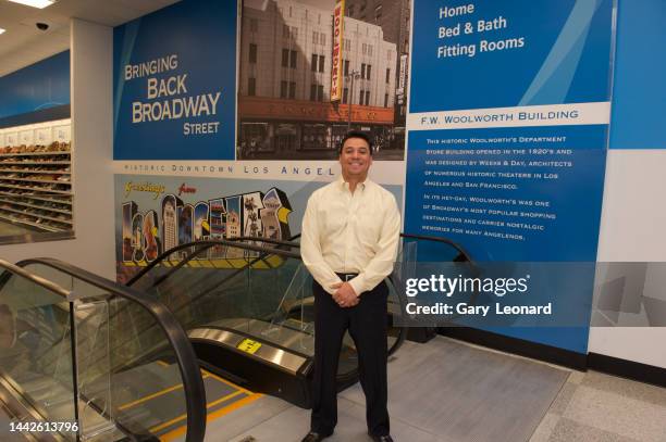 During the grand opening of Ross Dress for Less on Broadway Council Member José Huizar poses inside by the escalators with Bringing Back Broadway...