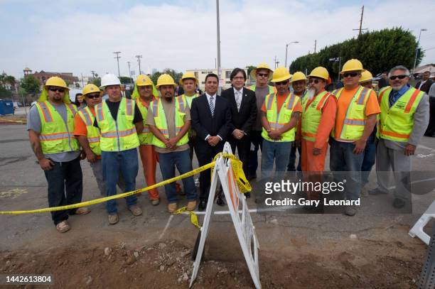 At a Boyle Heights Metro groundbreaking Council Member José Huizar poses for a group portrait with construction workers on April 23, 2013 in Los...