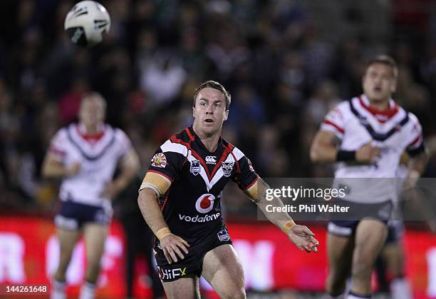 James Maloney of the Roosters passes the ball during the round 10 NRL match between the New Zealand Warriors and the Sydney Roosters at Mt Smart...