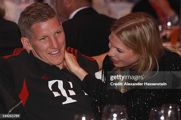 Bastian Schweinsteiger of Muenchen and Sarah Brandner during the Bayern Muenchen party at Telekom representative office on May 13, 2012 in Berlin,...