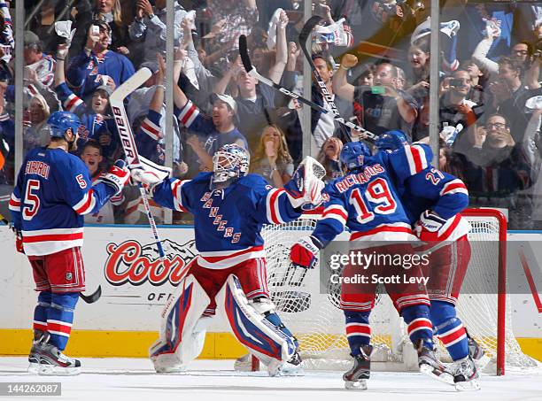Henrik Lundqvist of the New York Rangers celebrates the win against the Washington Capitals in Game Seven of the Eastern Conference Semifinals during...