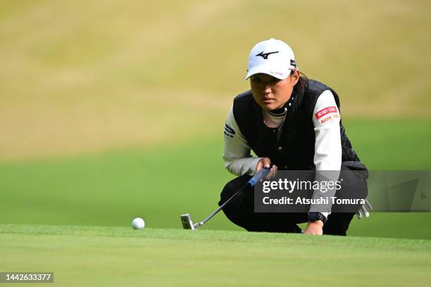 Mao Nozawa of Japan lines up a putt on the 4th green during the third round of Daio Paper Elleair Ladies at Elleair Golf Club Matsuyama on November...