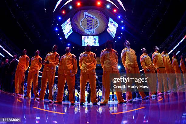 The Los Angeles Lakers stand during the national anthem before taking on the Denver Nuggets in Game Seven of the Western Conference Quarterfinals in...