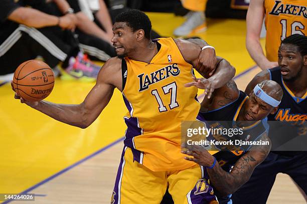 Andrew Bynum of the Los Angeles Lakers grabs the ball as he is tangled with Al Harrington of the Denver Nuggets in the second quarter in Game Seven...