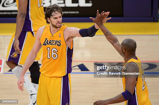 Pau Gasol and Kobe Bryant of the Los Angeles Lakers celebrate a play in the second quarter while taking on the Denver Nuggets in Game Seven of the...