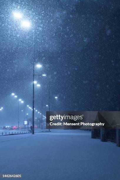 snowy empty road at night in city kiev - urban air vehicle stock pictures, royalty-free photos & images