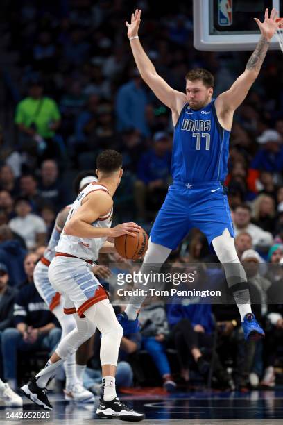 Michael Porter Jr. #1 of the Denver Nuggets dribbles the ball downcourt against Luka Doncic of the Dallas Mavericks in the second quarter at American...