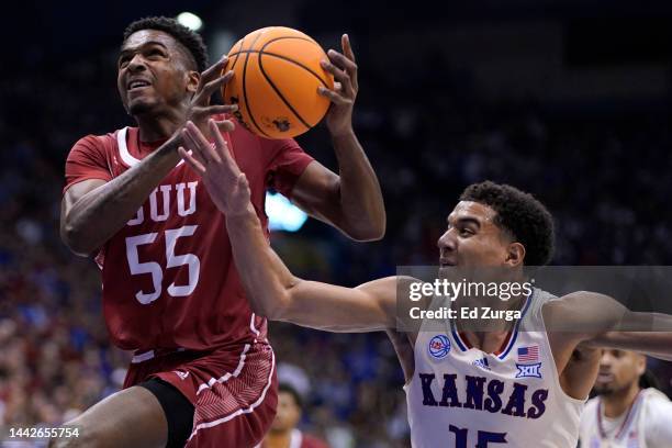 Tevian Jones of the Southern Utah Thunderbirds drives to the basket against Kevin McCullar Jr. #15 of the Kansas Jayhawks in the second at Allen...