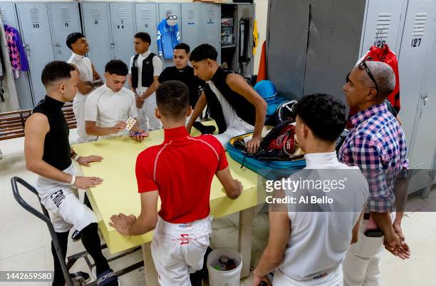 Group of Student Jockeys play cards in the locker room before their race at the Vocational Equestrian Agustín Mercado Reverón School located in the...
