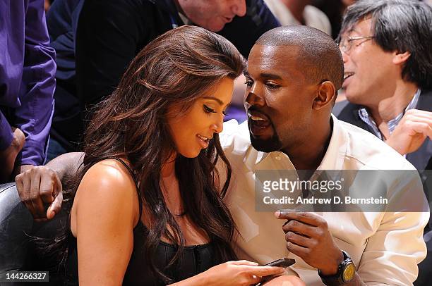 Kim Kardashian and recording artist Kanye West attend a game between the Denver Nuggets and the Los Angeles Lakers in Game Seven of the Western...