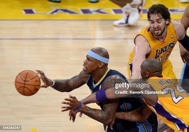 Al Harrington of the Denver Nuggets moves the ball in front of Kobe Bryant and Pau Gasol of the Los Angeles Lakers in the second half in Game Seven...