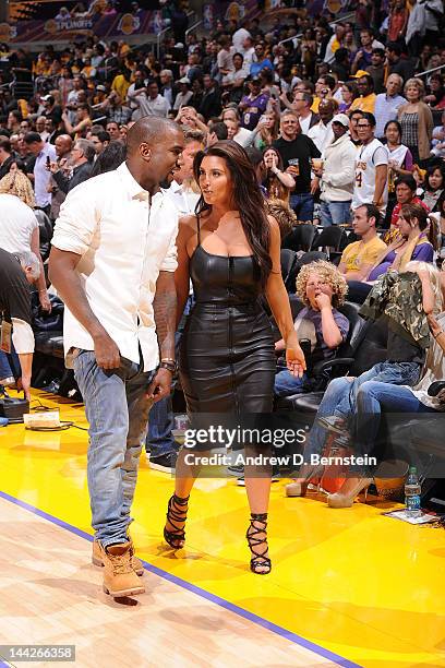 Kim Kardashian and recording artist Kanye West attend a game between the Denver Nuggets and the Los Angeles Lakers in Game Seven of the Western...