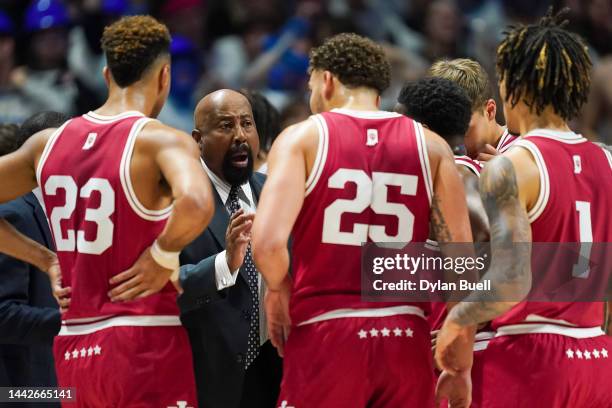 Head coach Mike Woodson of the Indiana Hoosiers meets with his team in the first half against the Xavier Musketeers at the Cintas Center on November...