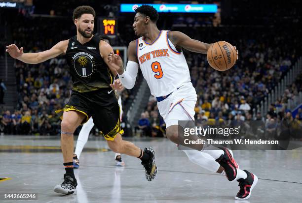 Barrett of the New York Knicks drives towards the basket on Klay Thompson of the Golden State Warriors during the second quarter of an NBA basketball...
