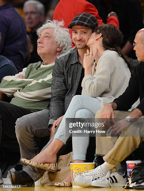 Justin Timberlake smiles as Jessica Biel gives him a kiss coutside as the Los Angeles Lakers take on the Denver Nuggets in Game Seven of the Western...