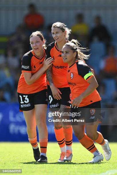 Larissa Crummer of the Roar celebrates with team mates after scoring a goal during the round one A-League Women's match between the Brisbane Roar and...