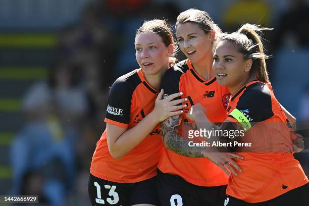 Larissa Crummer of the Roar celebrates with team mates after scoring a goal during the round one A-League Women's match between the Brisbane Roar and...