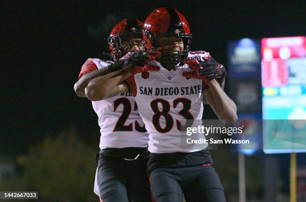 Wide receiver Mekhi Shaw of the San Diego State Aztecs and running back Kenan Christon of the San Diego State Aztecs celebrate after Shaw scored a...