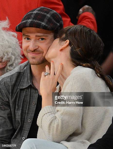 Justin Timberlake smiles as Jessica Biel gives him a kiss coutside as the Los Angeles Lakers take on the Denver Nuggets in Game Seven of the Western...