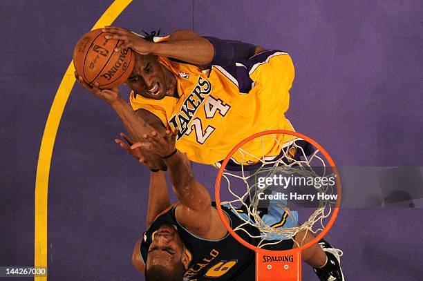 Kobe Bryant of the Los Angeles Lakers goes up for a shot over Arron Afflalo of the Denver Nuggets in the first half in Game Seven of the Western...