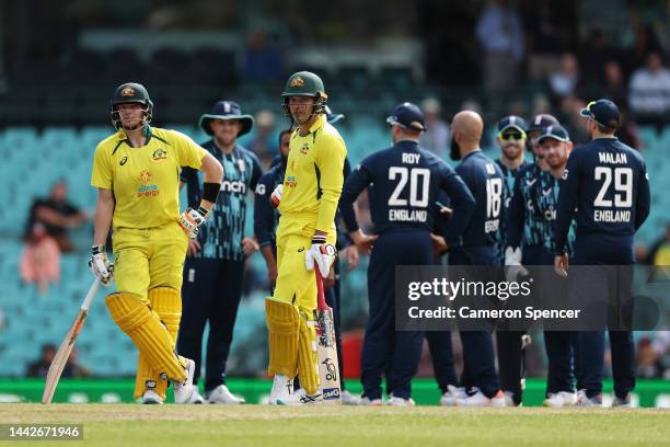 Steve Smith of Australia and Alex Carey of Australia wait for a DRS review during Game 2 of the One Day International series between Australia and...