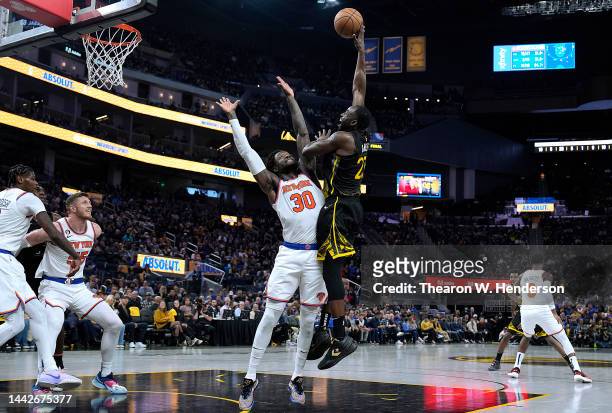 Draymond Green of the Golden State Warriors shoots over Julius Randle of the New York Knicks during the third quarter of an NBA basketball game at...