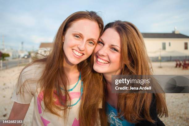 best friends, two female friends having fun outside, sisters adult - cousins stockfoto's en -beelden