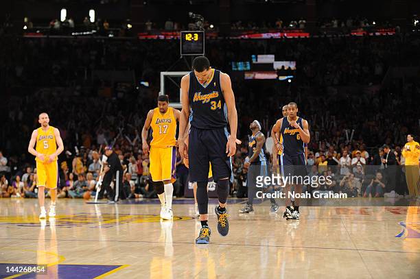 JaVale McGee of the Denver Nuggets walks dejectedly on the court during the game against the Los Angeles Lakers in Game Seven of the Western...