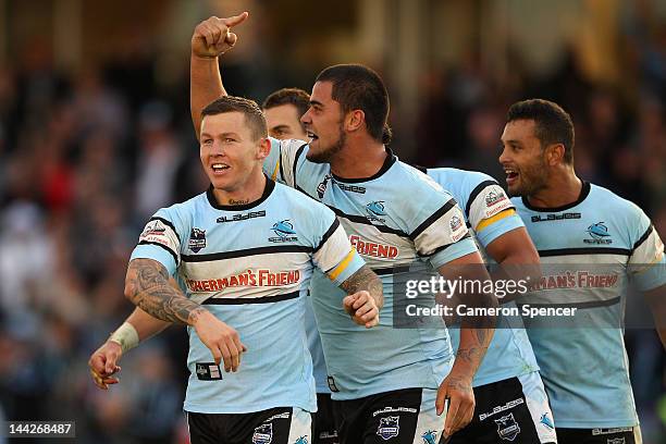 Todd Carney, Andrew Fifita of the Sharks and team mates celebrate winning the round 10 NRL match between the Cronulla Sharks and the Melbourne Storm...