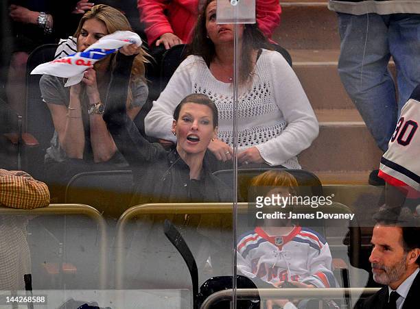 Linda Evangelista and son Augie attend New York Rangers vs Washington Capitals playoff game at Madison Square Garden on May 12, 2012 in New York City.