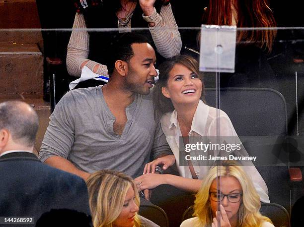 John Legend and Chrissy Teigen attend New York Rangers vs Washington Capitals playoff game at Madison Square Garden on May 12, 2012 in New York City.