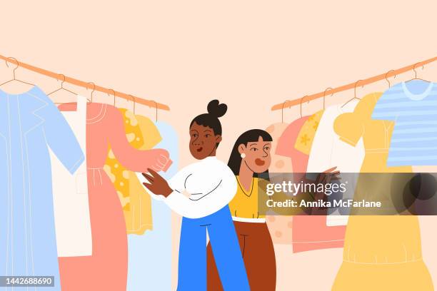 ilustraciones, imágenes clip art, dibujos animados e iconos de stock de un amigo negro y asiático van juntos a buscar ropa en una tienda de segunda mano - frugalidad