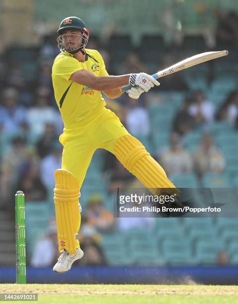 Marcus Stoinis of Australia leaps as he bats during Game 2 of the One Day International series between Australia and England at Sydney Cricket Ground...