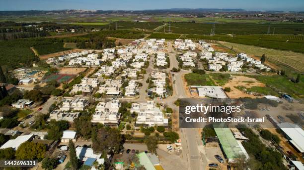 aerial view of a rural village in israel - kibbutz stock-fotos und bilder