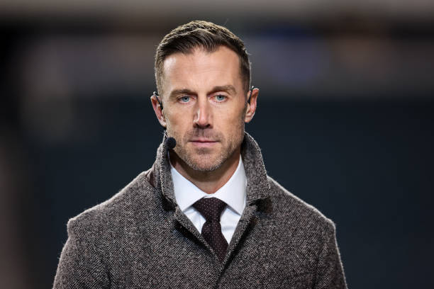 Former NFL player and current NFL analyst Alex Smith looks on before the game between the Philadelphia Eagles and the Washington Commanders at...