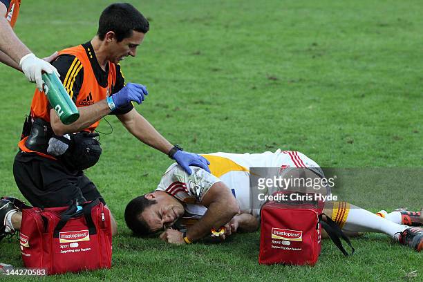 Richard Kahui of the Chiefs is treated after being injured during the round 12 Super Rugby match between the Reds and the Chiefs at Suncorp Stadium...