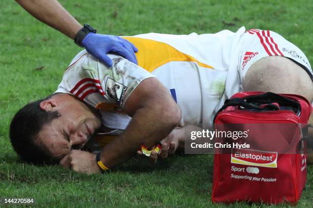 Richard Kahui of the Chiefs is treated after being injured during the round 12 Super Rugby match between the Reds and the Chiefs at Suncorp Stadium...