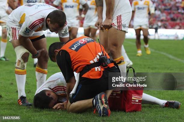Richard Kahui of the Chiefs is treated after being injured during the round 12 Super Rugby match between the Reds and the Chiefs at Suncorp Stadium...