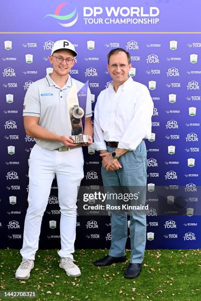 Rasmus Lia of Sweden and Danny van Otterdijk Chief Communications Officer of Group Communications, DP World poses with the trophy and after winning...