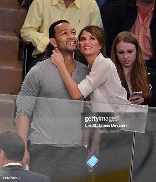 John Legend and Chrissy Teigen attend New York Rangers versus Washington Capitals playoff game at Madison Square Garden on May 12, 2012 in New York...