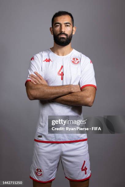 Yassine Meriah of Tunisia poses during the official FIFA World Cup Qatar 2022 portrait session on November 18, 2022 in Doha, Qatar.