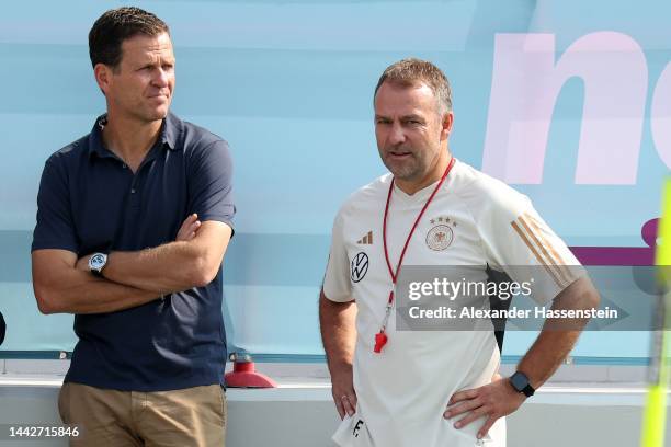 Hans-Dieter Flick, head coach of Germany looks on with Team mager Oliver Bierhoff during the Germany training session at Al Shamal Stadium on...