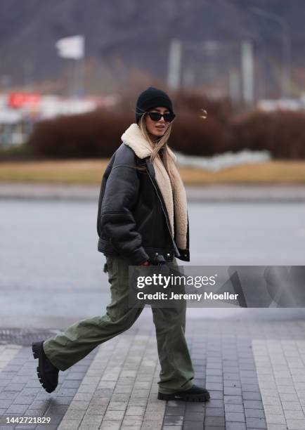 Bruna Ritzk is seen wearing black oversized Acne Studios leather jacket, Bottega Veneta black leather mini Jodie bag, black Celine sunglasses,...