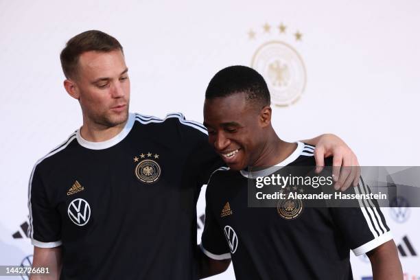 Manuel Neuer of Germany reacts with his team mate Youssoufa Moukoko after the Germany press conference at DFB Media Centre on November 19, 2022 in Al...