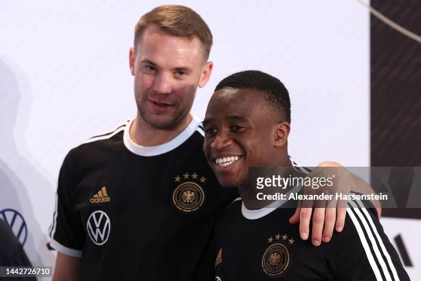 Manuel Neuer of Germany reacts with his team mate Youssoufa Moukoko after the Germany press conference at DFB Media Centre on November 19, 2022 in Al...