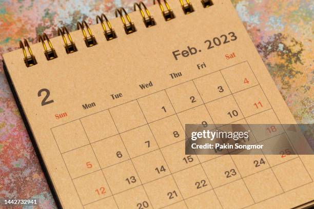 calendar desk 2023: february is the month for the organizer to plan and deadline with a grunge paper background. - februar stock-fotos und bilder